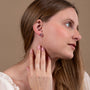 Amethyst Cross Stud Earrings in 925 Sterling Silver – shown worn, close-up