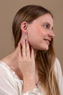 Blue Opal Cross Drop Earrings in 925 Sterling Silver – shown worn