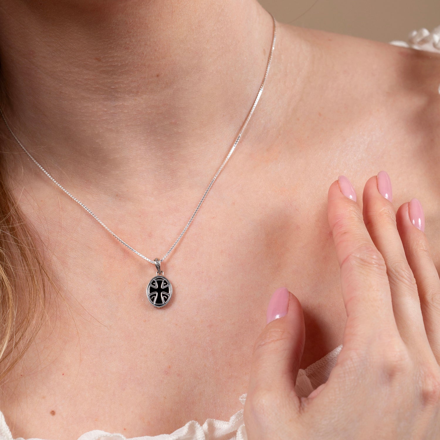 Flared Cross Pendant Necklace in 925 Sterling Silver with Black Onyx – shown worn, close-up