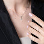 Polished Cross Pendant Necklace, Small Flared Arms, 925 Sterling Silver – shown worn, close-up
