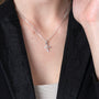 Cross Pendant Necklace, Cubic Zirconia Tips, 925 Sterling Silver – shown worn, close-up