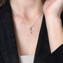 Cross Pendant Necklace, Cubic Zirconia Tips, 925 Sterling Silver – shown worn, close-up