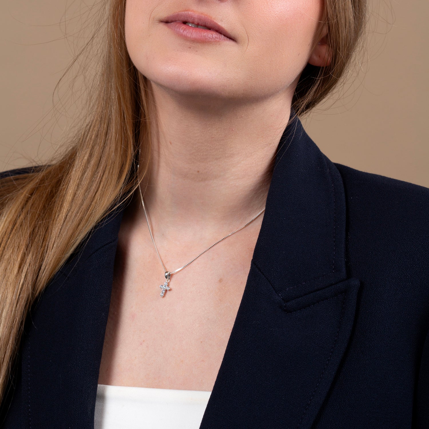 White Zircon Cross Pendant Necklace in 925 Sterling Silver – shown worn