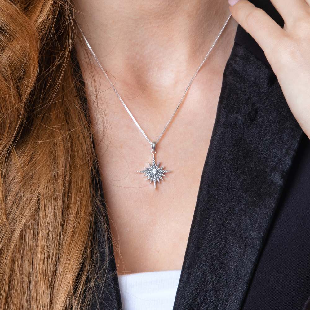 Star of Bethlehem Pendant Necklace in 925 Sterling Silver with Cubic Zirconia – shown worn, close-up
