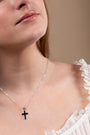 Black Onyx Cross Pendant Necklace, Large, Broad Arms, 925 Sterling Silver – shown worn, close-up
