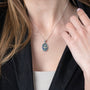 Ornate Dove Pendant Necklace in 925 Sterling Silver with Eilat Stone – shown worn, close-up