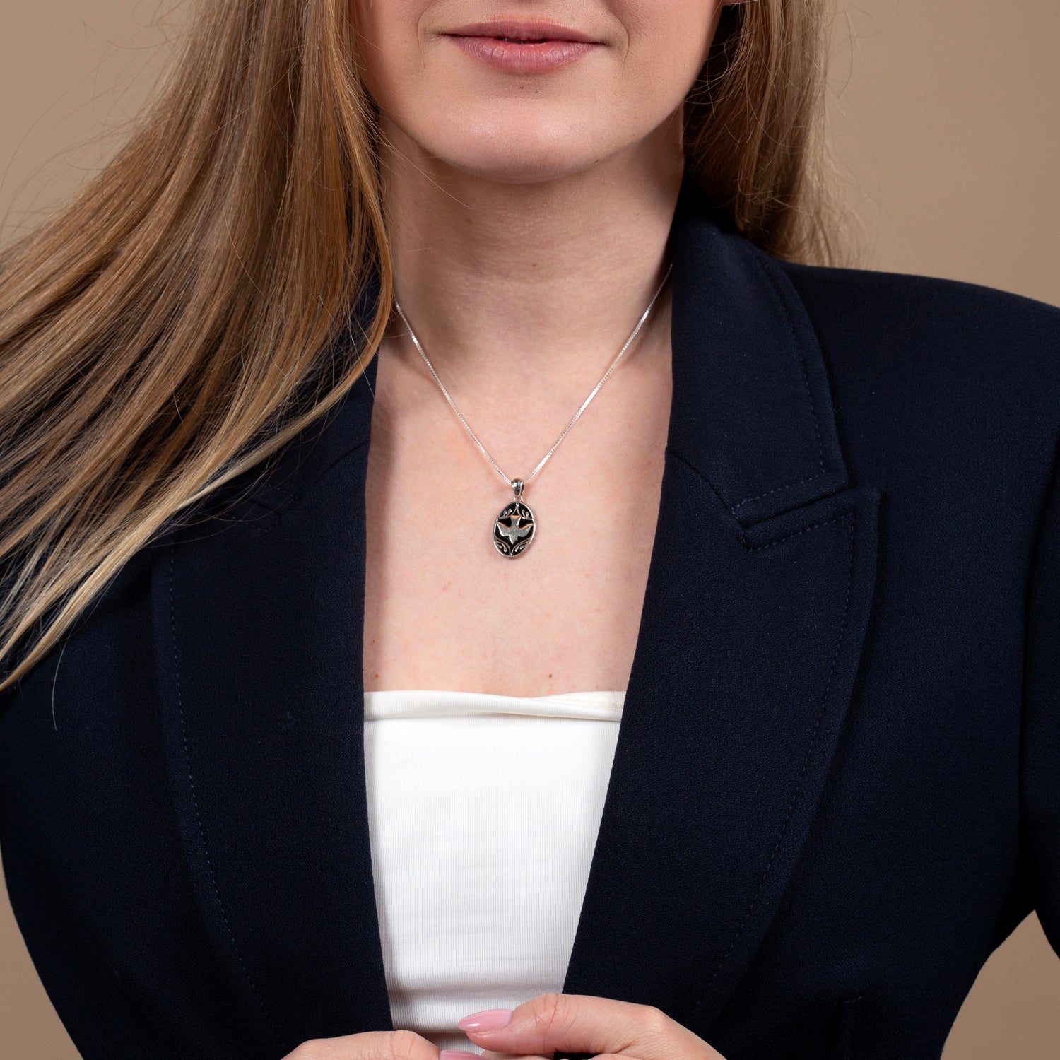 Dove on Black Onyx Oval Pendant Necklace in 925 Sterling Silver – shown worn, close-up