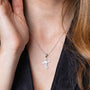 Wavy Cross and Dove Pendant Necklace in 925 Sterling Silver – shown worn, close-up
