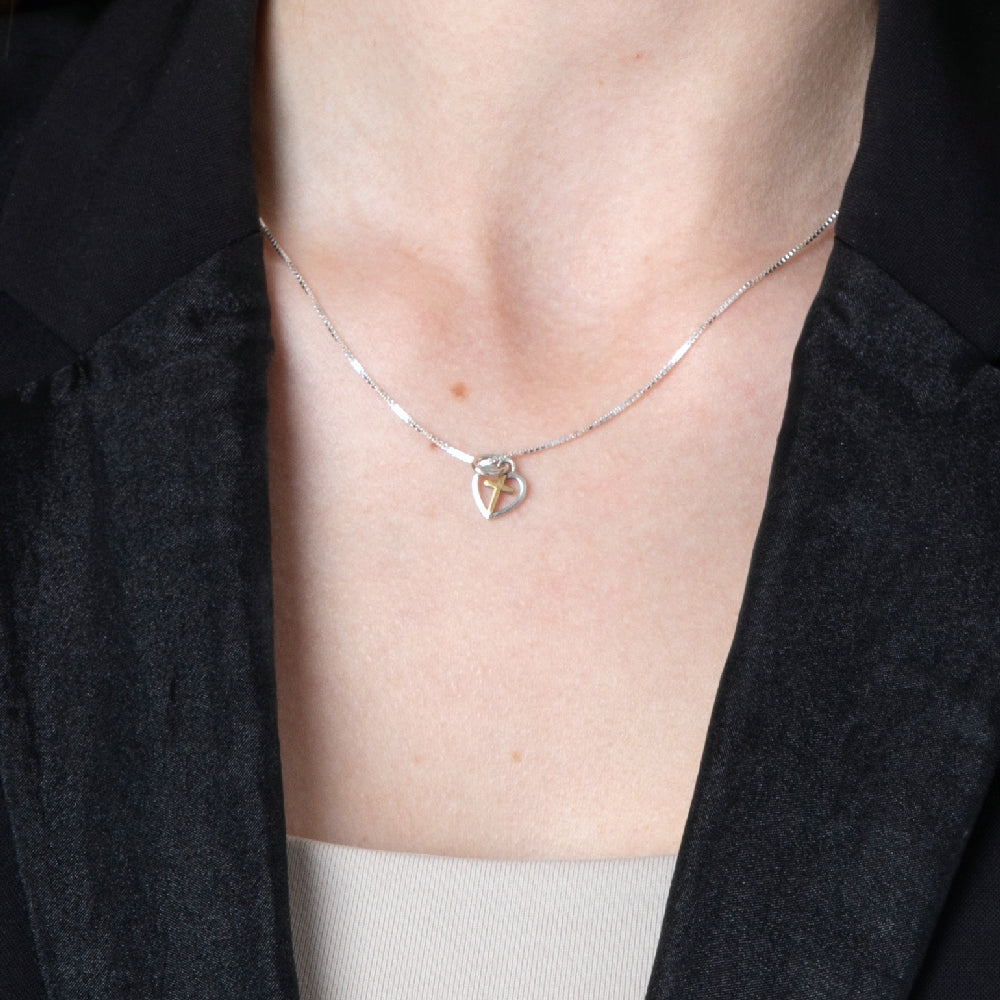 Cross in Heart Pendant Necklace in 925 Sterling Silver, Gold Plated – shown worn, close-up