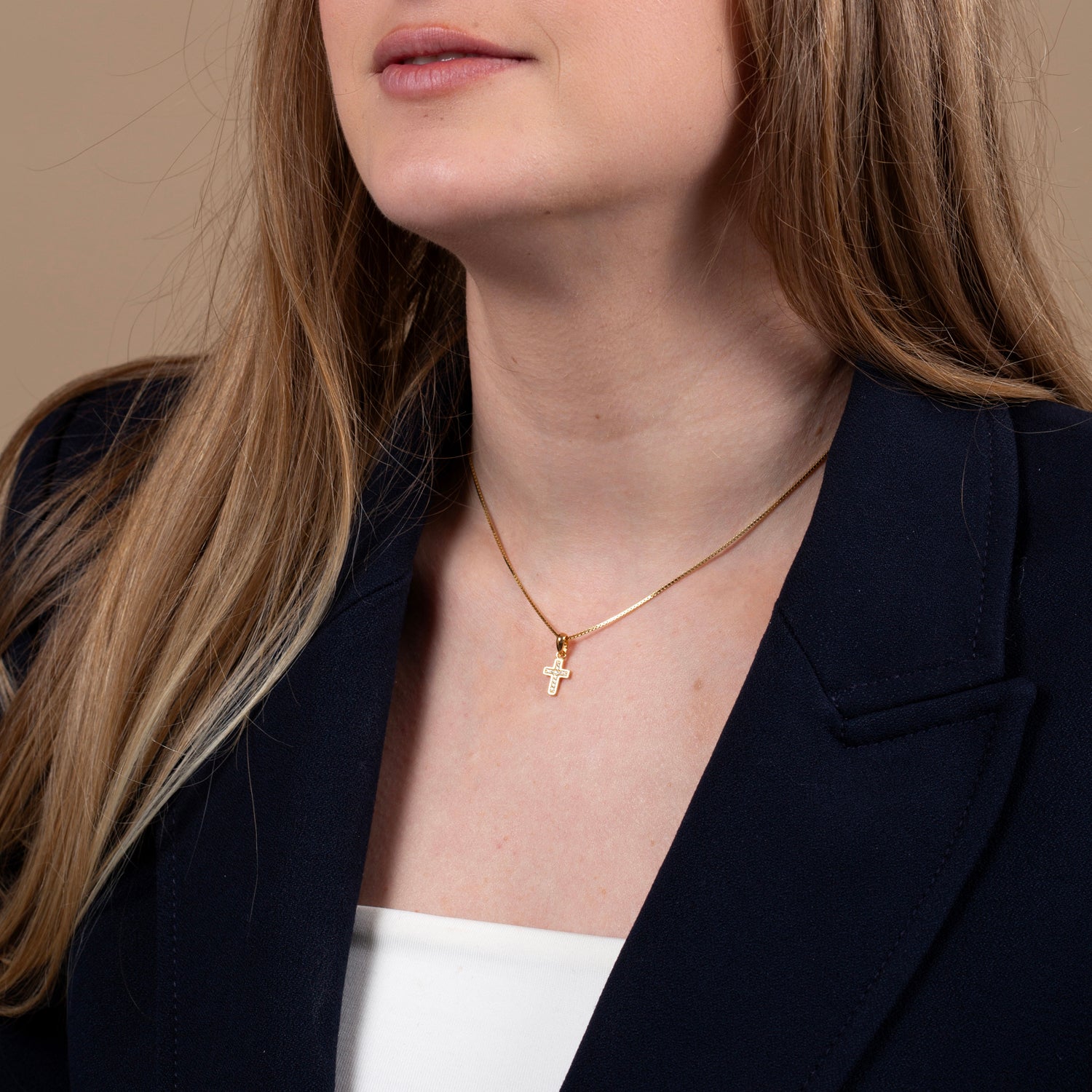 Cross Pendant Necklace in Gold-Plated 925 Sterling Silver with Cubic Zirconia – shown worn, close-up