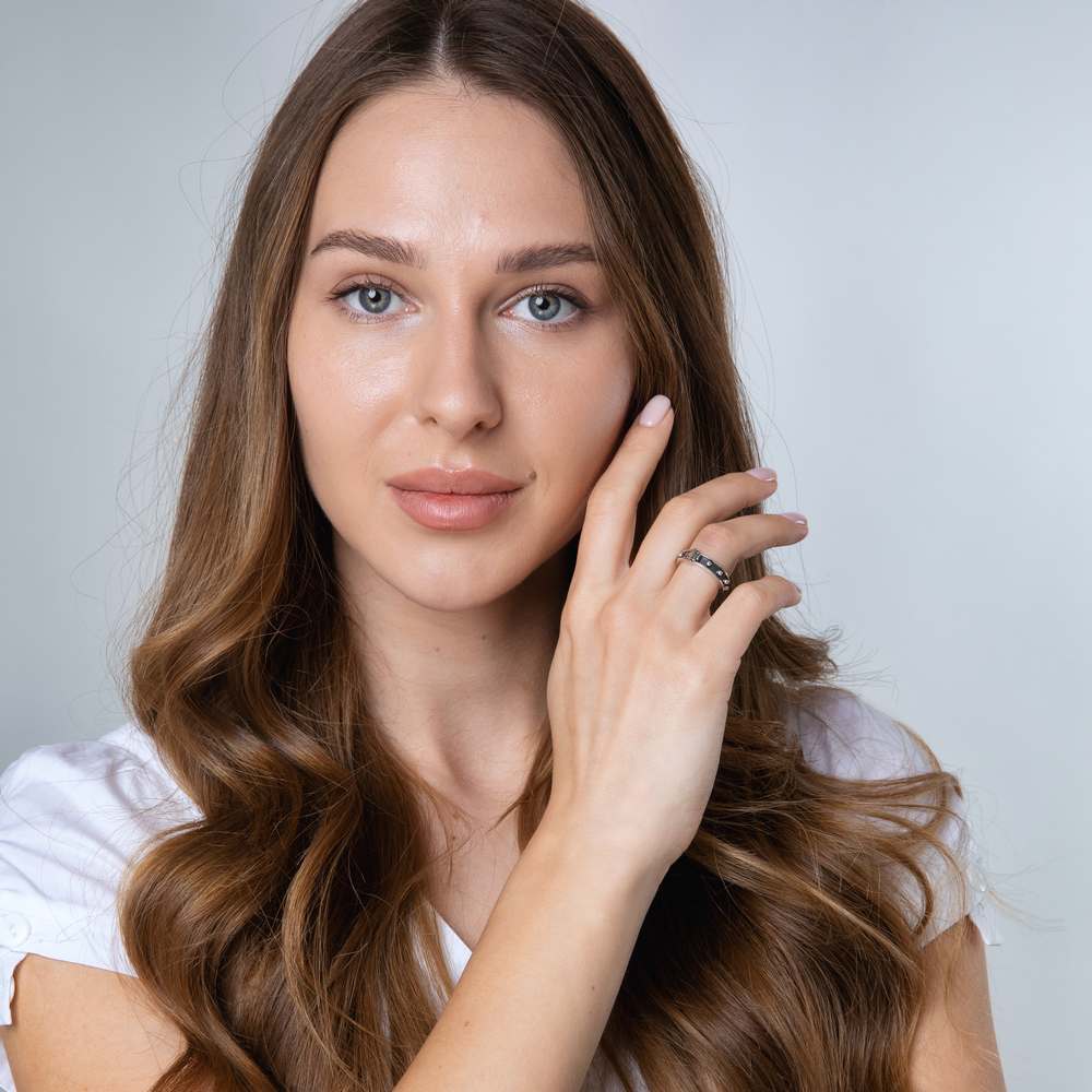 Woman wearing the Jerusalem Cross decade rosary ring by Marina Jewelry