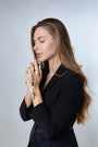 Black Wood Rosary with Jordan River Water & Crucifix – shown worn