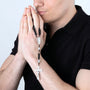 Black Wood Rosary with Jordan River Water & Crucifix – shown worn