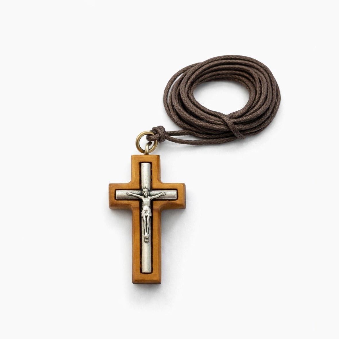 Olive wood cross pendant with an inset silver-tone crucifix on a brown cord, by Marina Jewelry